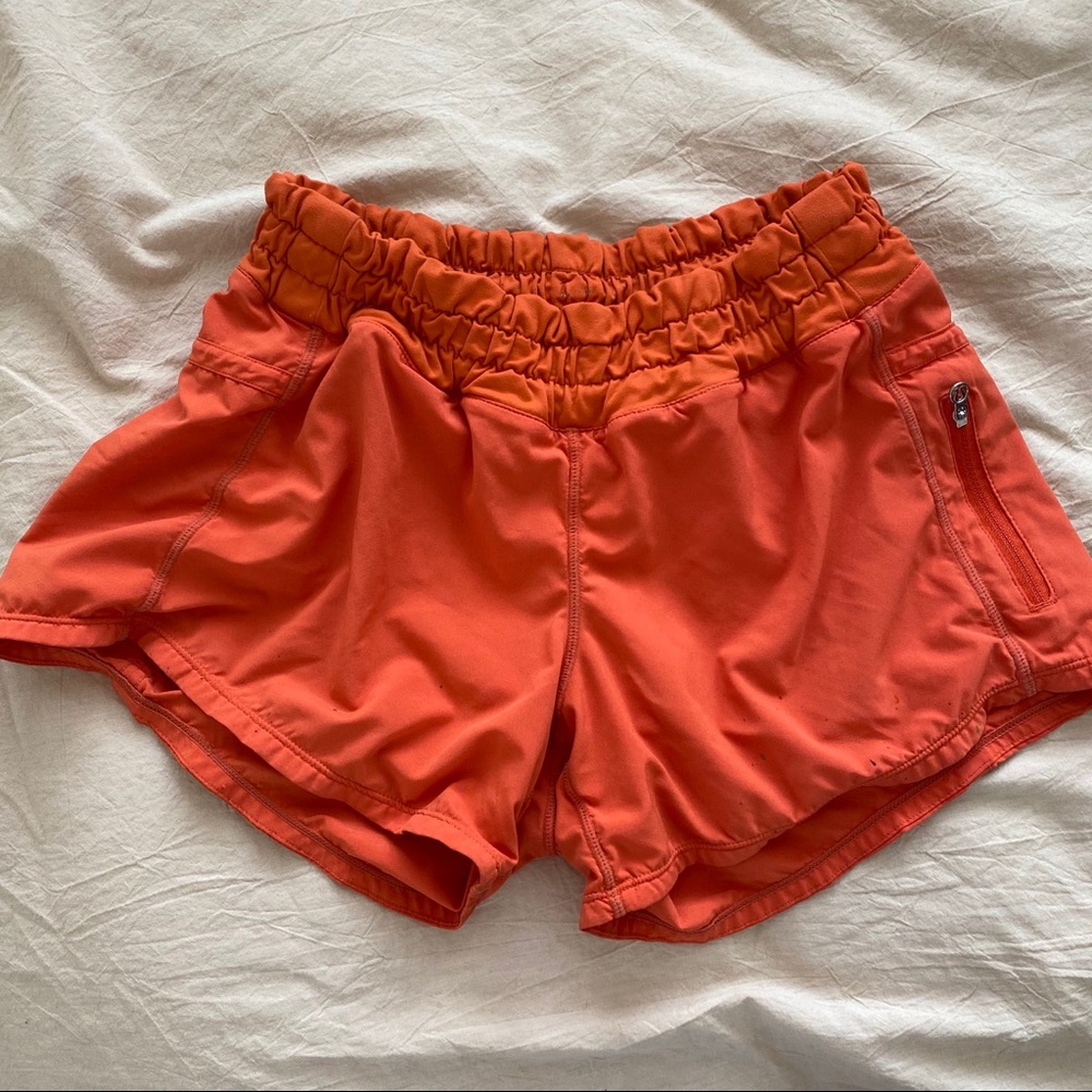 LULU LEMON orange running shorts (size 4)